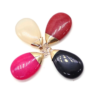 Polished natural stone teardrop pendants in ivory, red, pink, and black with gold loops