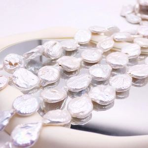 String of high-quality 20mm baroque freshwater button pearls with iridescent luster