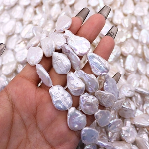 Natural baroque freshwater pearl strand with iridescent white teardrop shape beads