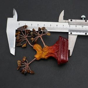 Macro shot of tiger eye crystal wire tree showing 7.5cm height measured by caliper