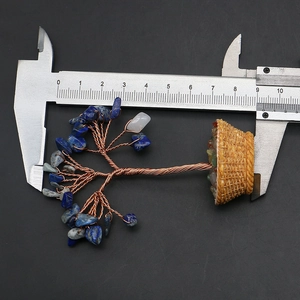 Detailed macro view showing a 9cm mini crystal money tree with copper wire and blue stones