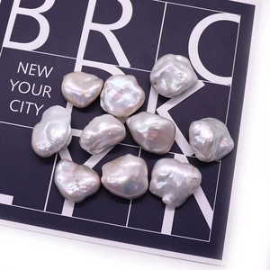 Ten pieces of natural baroque freshwater pearls in silvery white with iridescent luster