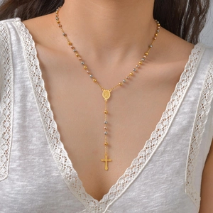 Three-tone rosary Y-necklace with Virgin Mary medal and crucifix worn on model