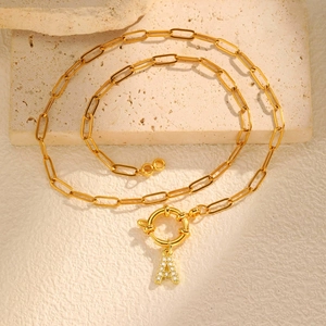 Detail of 18K gold-plated paperclip chain necklace with sparkling zircon initial A pendant