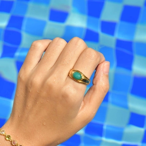 Vintage 18K gold plated stainless steel oval amazonite ring worn on hand at the pool