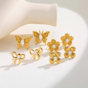 Elegante set de pendientes dorados con circonita brillante diseños de flores y lazos