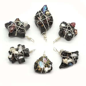 Handmade set of six star and leaf shaped black resin pendants with freshwater pearls