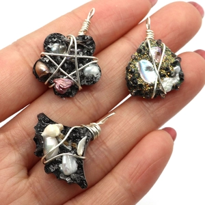 Handmade black resin pendants with natural freshwater pearls and silver wire wrapping