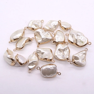 Baroque style irregular imitation pearl pendants with gold plated frames and dual connectors