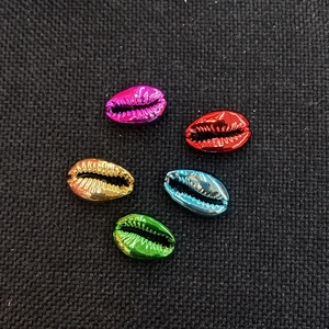 Macro shot of electroplated metallic shell beads in multiple colors for DIY jewelry making