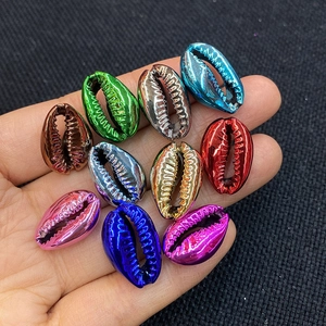 Close-up of assorted metallic electroplated sea shell beads for DIY jewelry making