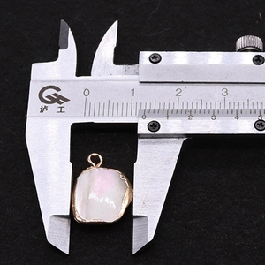 Detailed measurement of natural mother of pearl shell pendant with gold plated metal edge