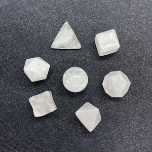 Detailed top view of 7 sacred geometry crystals including sphere and polyhedrons on black