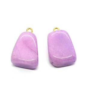 Set of two purple natural stone pendants with gold metal loops on white background