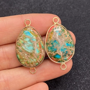 Waterdrop-shaped imperial stone pendants with golden metal frames and dual connectors