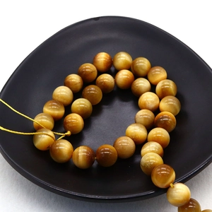 Polished natural tiger eye stone beads set in black tray for DIY jewelry making