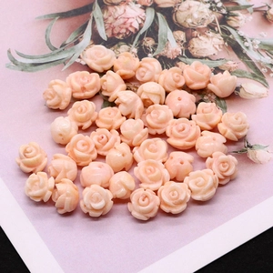 Delicate pink coral rose beads for DIY jewelry making on romantic floral card