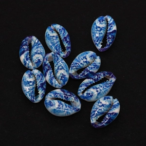 Detailed view of ten blue and white marble pattern natural shell beads for jewelry making