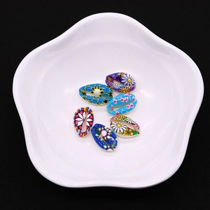 Colorful painted natural cowrie shells set for bohemian jewelry making and DIY necklaces