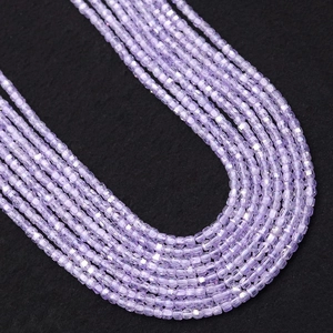 Macro detail of 2-3mm faceted lavender natural stone beads for DIY jewelry making