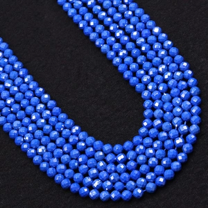 Macro shot of 2-3mm faceted blue turquoise round beads for DIY jewelry making and crafts