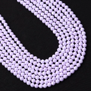 Macro shot of faceted lavender beads for DIY jewelry making with light reflections