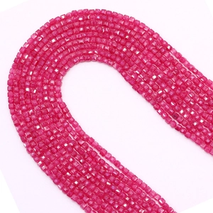 Macro shot of 2.5mm faceted rose red square natural stone beads for DIY jewelry making