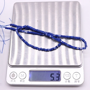 Detailed view of square blue stone beads on a scale showing 5.3g weight for DIY jewelry