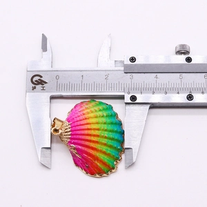 Macro detail of natural shell pendant width measurement using a digital caliper