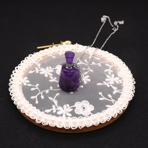 Natural amethyst essential oil bottle necklace with silver chain on lace embroidery