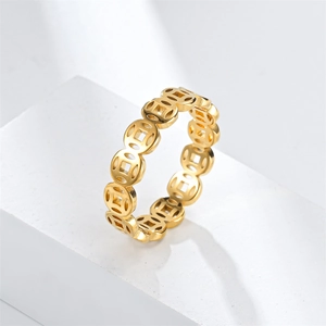 Detail view of 18k gold plated titanium steel ring with ancient Chinese coin pattern