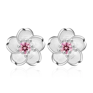 Pink zircon cherry blossom silver stud earrings with white petals on white background