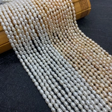 Detail of A-grade oval freshwater pearls in white and pink on a bamboo display mat