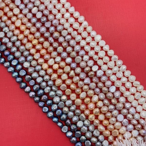 Macro shot of Grade A multi-colored freshwater pearls showing high luster and baroque textures