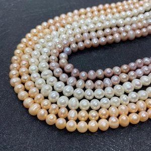 Natural freshwater pearl strands in white, pink, and purple for DIY jewelry making