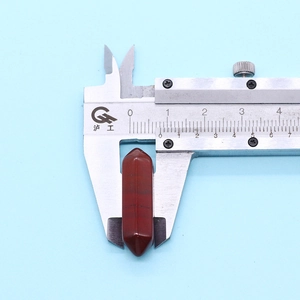 Measuring the 32mm red jasper hexagonal crystal column pendant with professional calipers