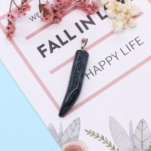 Malachite horn pendant with silver metal bail on a decorative floral background card