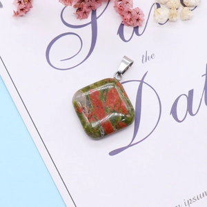 Detailed macro view of Unakite stone square pendant with a polished silver metal clasp
