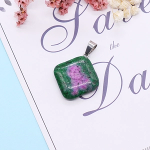 Macro shot of natural Ruby in Zoisite square pendant with silver clip on art card