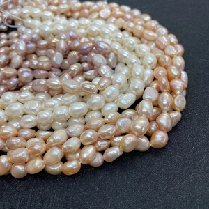 Natural freshwater pearl strands in white, pink, and lilac for DIY jewelry making