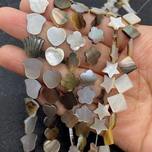 Natural sea shell beads in heart and star shapes with iridescent luster for DIY jewelry