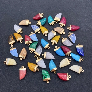 Malachite and lapis horn-shaped faceted pendants with gold-plated edges in a multi-stone set