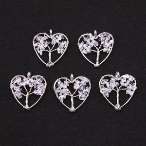 Handcrafted tree of life heart pendants with purple fluorite crystals in silver wire