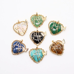 Set of 7 heart-shaped natural stone pendants with gold wire wrap and butterfly charms