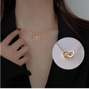 Élégant collier doré à deux cœurs entrelacés en acier titane pour femmes bijoux tendance