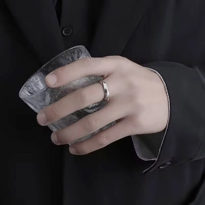 Silver Mobius twisted titanium steel ring for men and women worn on finger with glass