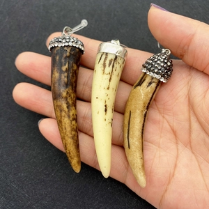 Handheld horn-shaped resin pendants with sparkling rhinestone caps in white and brown
