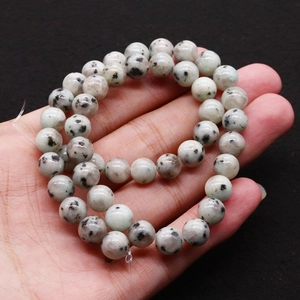 Bracelet en perles rondes de jaspe dalmatien naturel avec taches noires et grises