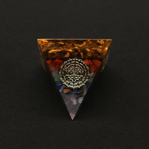 Macro detail of Orgonite Pyramid featuring Sri Yantra symbol and layered natural stones