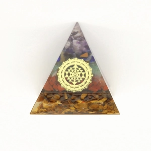Orgone pyramid pendant with Sri Yantra symbol and layered natural stones for healing